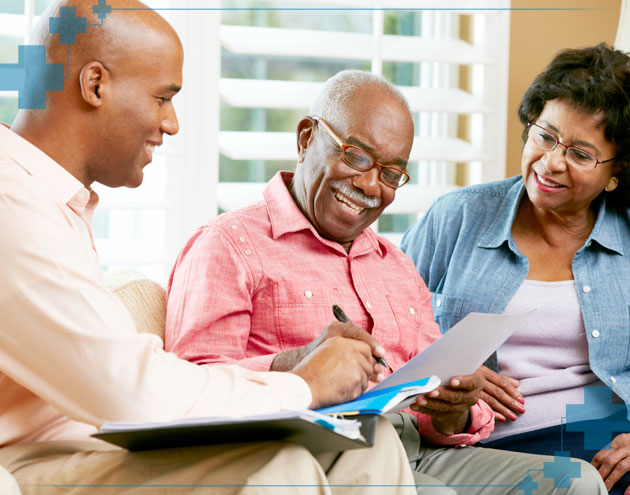 Senior couple signing up for dental insurance