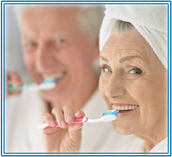 Elderly couple brushing their teeth